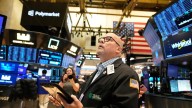 Wall St tumbles, investors fret Fed may slow rate cuts