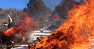 Slash pile burning operation happening southeast of Cache Valley