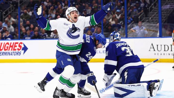Hughes has 4 assists in return from injury, Canucks surge past Lightning