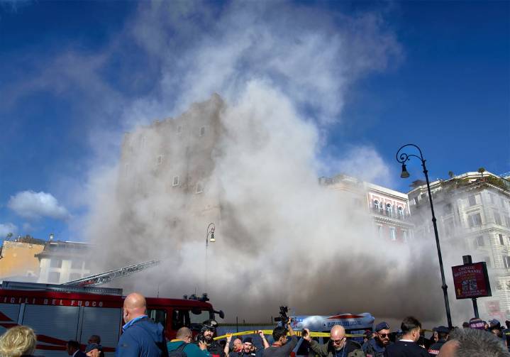 Rescuers work to reach worker trapped in medieval tower that partially collapsed in Rome