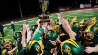 Audubon football brings home the hardware after Thanksgiving Eve win