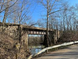 Concrete repair work underway on Stumphole Bridge over White River