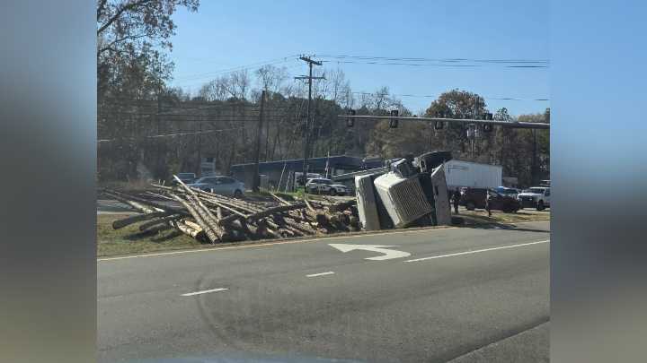 Tractor-trailer carrying logs flips, shutting down eastbound lanes of Route 10 in Chester