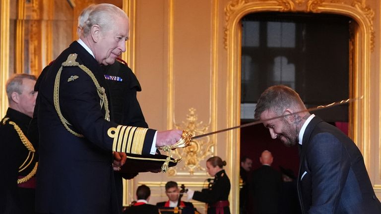 Sir David Beckham receives knighthood from the King at Windsor Castle ceremony