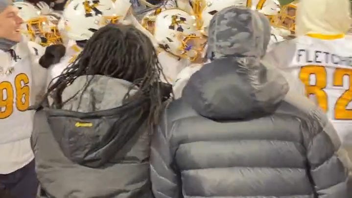 Kent State football players seize the Wagon Wheel after win vs, Akron