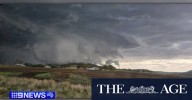 Large hail and lightning hit Queensland as residents brace for severe storms