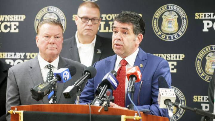 Man charged with murder following deadly shooting at used car dealership