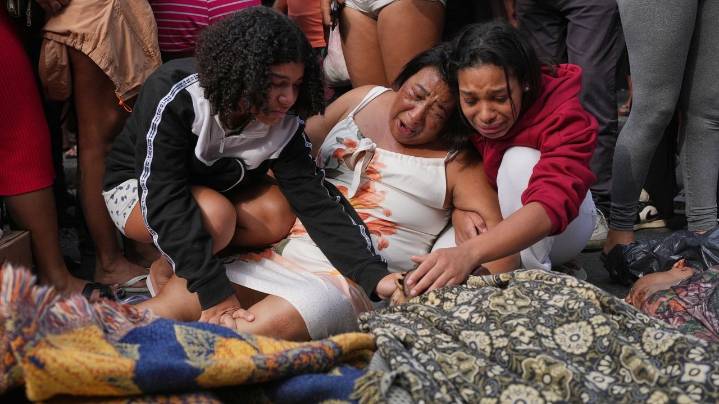 Rio favelas left reeling after lethal gang raid as families bury the dead