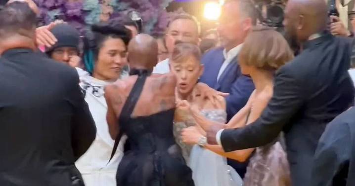 Ariana Grande grabbed by fan at Wicked premiere as co-star Cynthia jumps to save her
