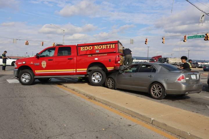 IFD vehicle lands on another car after being struck