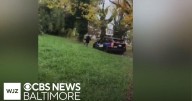 Baltimore officer suspended without pay after video shows him chasing person with patrol car