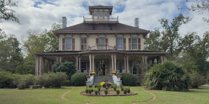 Elaborate ceiling, wall murals line inside of historic Eufaula home