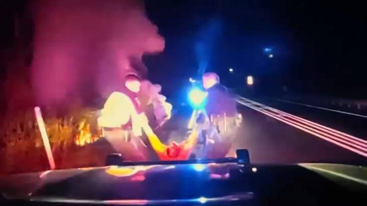 New Jersey police pulled man from burning car, say phone may have saved his life