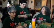 Las Chulas en Rojo honor veterans with handmade holiday wreaths