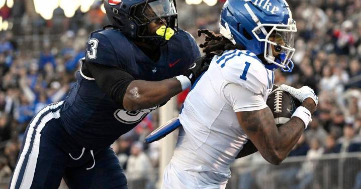 Late fumble recovery clinches UConn's 37-34 come-from-behind win over the visiting Duke