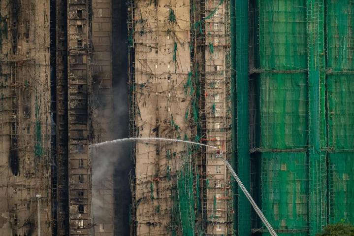 Hong Kong firefighters battle burning towers for a second day