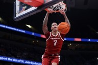 Arkansas forward Trevon Brazile apologizes after hitting fan with towel