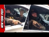 Moment ICE Officer Points Gun at Outraged Chicago Protesters