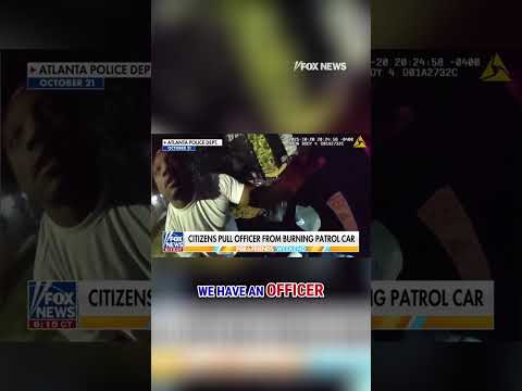 SEE IT: Bystanders pull police officer from burning patrol car #shorts #foxnews #us #news