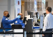 Thousands of airport workers on the job without pay