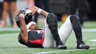 Michael Penix exits with knee injury, Kirk Cousins in for Falcons