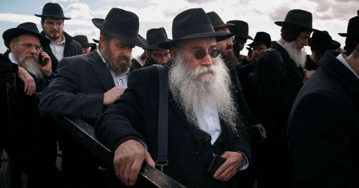 Photos of Hasidic Jewish rabbis praying at resting place of 'the Rebbe' in New York