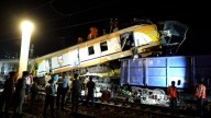At least 11 killed in India train crash as rescuers recover bodies