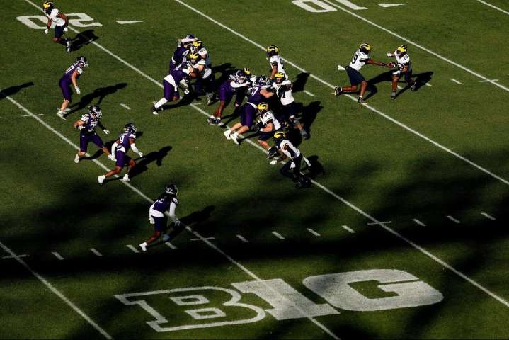 At Wrigley Field, Michigan's long-running Big Ten animosity takes a day off