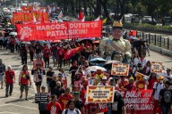 Thousands of anti-corruption protesters in Manila say Marcos must resign