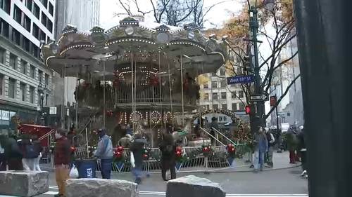 NYC's Double Decker Christmas Carousel opens in Greeley Square, between Penn Station and Empire State Building
