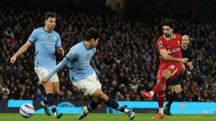 Man City and Liverpool clash to keep Arsenal within reach