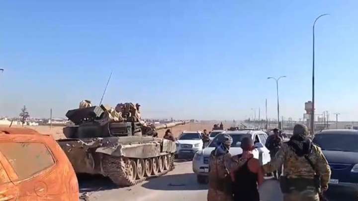 Israeli forces kill at least 13 people in southern Syria raid, officials and residents say