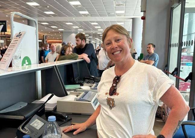 Mum takes over crowded airport’s PA system and helps board eight planes