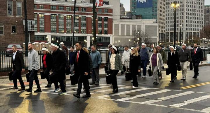 ‘Briefcase brigade’ returns for Thanksgiving Day parade in Detroit