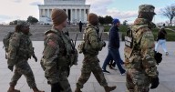 US halts all asylum decisions after shooting of National Guard members