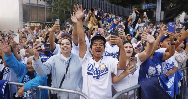 Commentary: From far away, an L.A. couple grapples with all-too-familiar debate after Dodgers win
