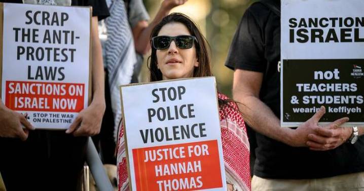 'Relief' as cop charged with assaulting protester named