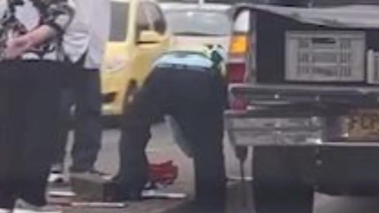 ‘Héroe en la vía’: agente de tránsito ayudó a pareja de adultos mayores varada en puente de La Minorista