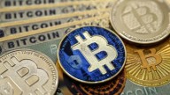 Bitcoin tumbles to seven-month low amid us economic concerns
