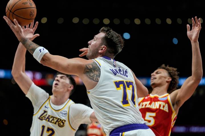 Sluggish Lakers trounced by short-handed Hawks to end winning streak
