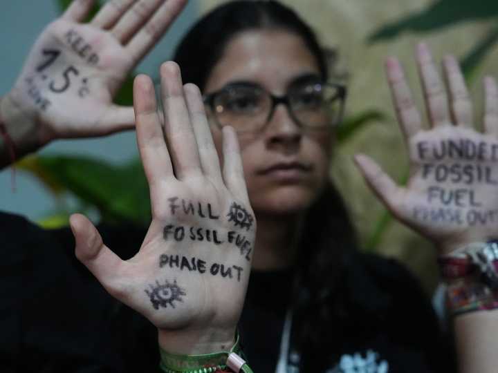 UN climate talks go into overtime as divisions over fossil fuels persist