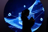 Analysis-China's internet firms cautiously revive lending as Beijing pushes consumer loans