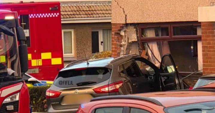 Car smashes into house in Scottish town as police tape off street