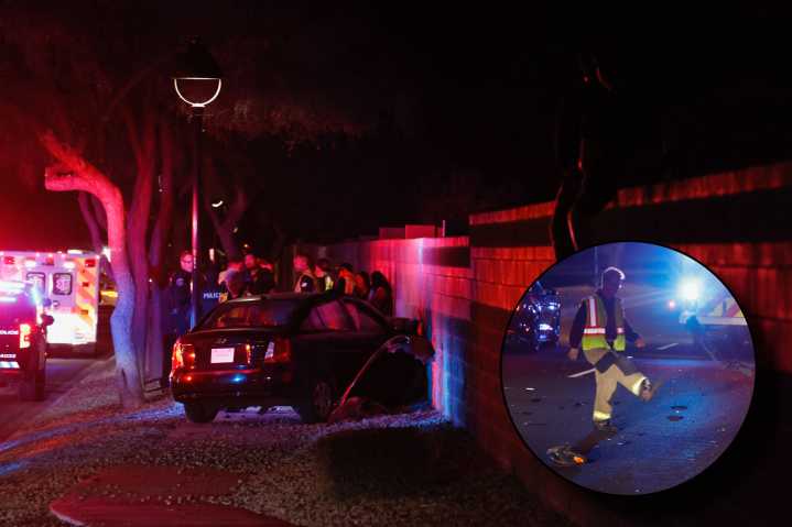 Suspected distracted driver hospitalized after wall collision on Smith