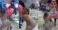 Madre perrea con vestido con transparencia en el cumpleaños de su pequeña hija