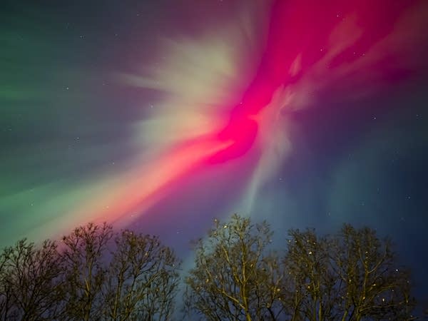 In vivid red and green, stunning aurora display sweeps across Minnesota skies