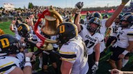 DePauw wheels the Monon Bell and rings it in victory after a win at Wabash
