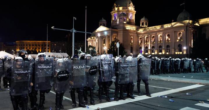 Riot police separate opponents, loyalists of Serbia's president as tensions soar amid protests