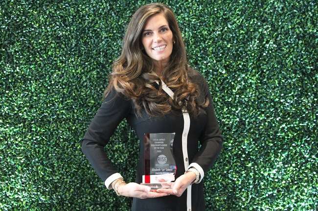 Partnership for R.I. director receives Social Impact Award for community leadership