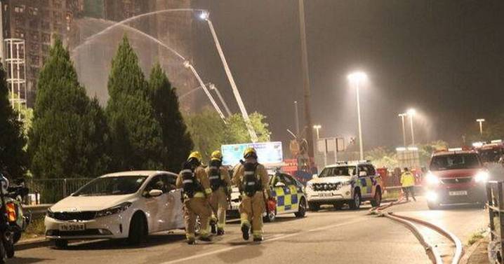 Death toll rises to 94 after Hong Kong blaze as firefighters continue to battle huge fire
